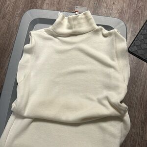 Maxi sleeveless , turtleneck dress with slit